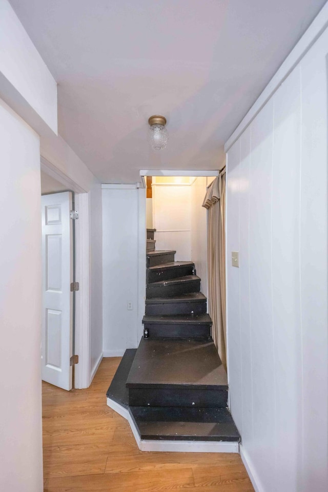 stairway featuring light wood-type flooring