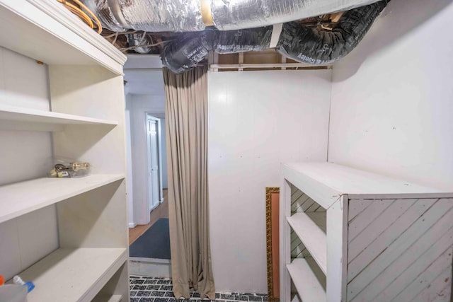 walk in closet featuring tile floors