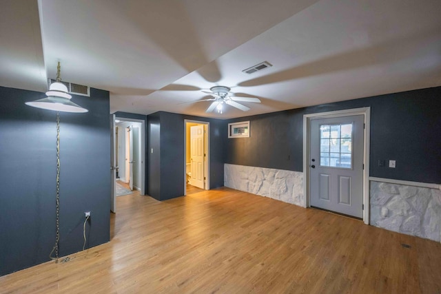 spare room with ceiling fan and light hardwood / wood-style flooring