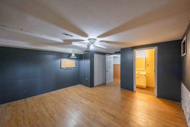 interior space with ceiling fan and light wood-type flooring