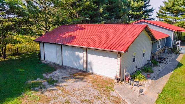 garage with a lawn