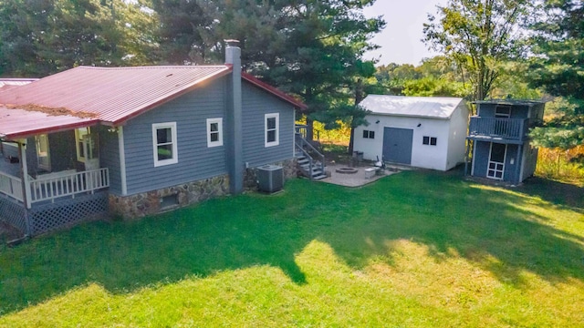 exterior space with a lawn and central air condition unit