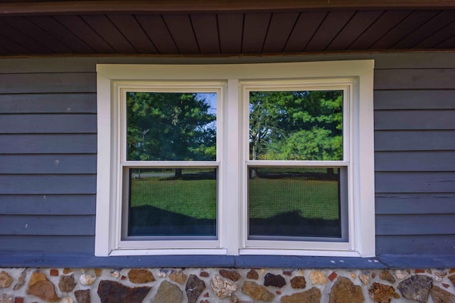 exterior details featuring wood ceiling