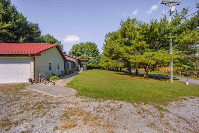 view of yard featuring a garage