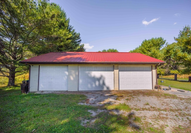 garage with a lawn