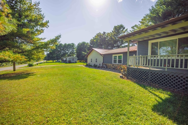 view of yard with a deck