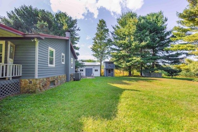 view of yard with central AC unit