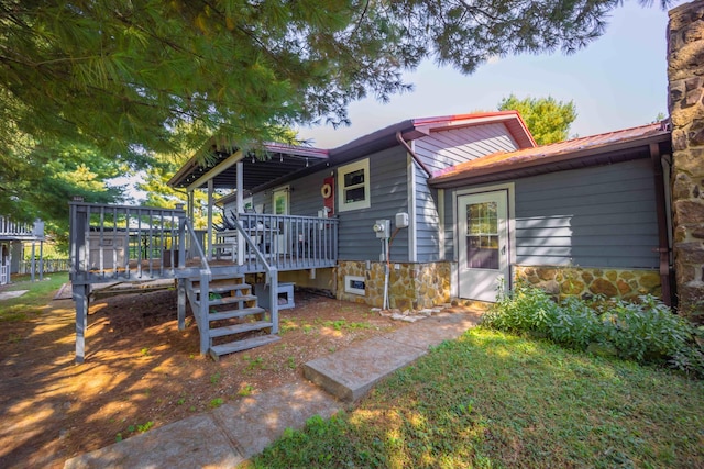 exterior space featuring a wooden deck