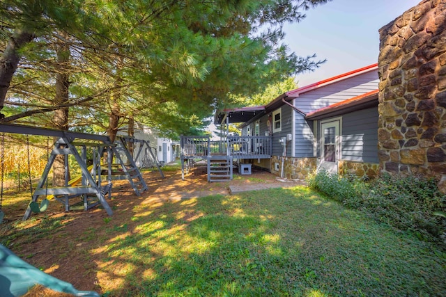 view of yard with a wooden deck