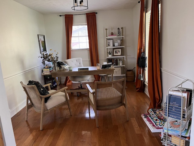 office space with a textured ceiling and hardwood / wood-style floors