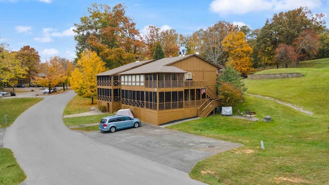 rear view of house with a yard