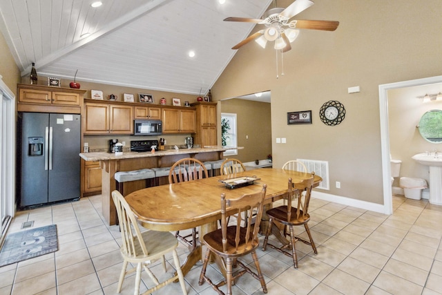 dining area with wood ceiling, high vaulted ceiling, ceiling fan, and light tile patterned flooring