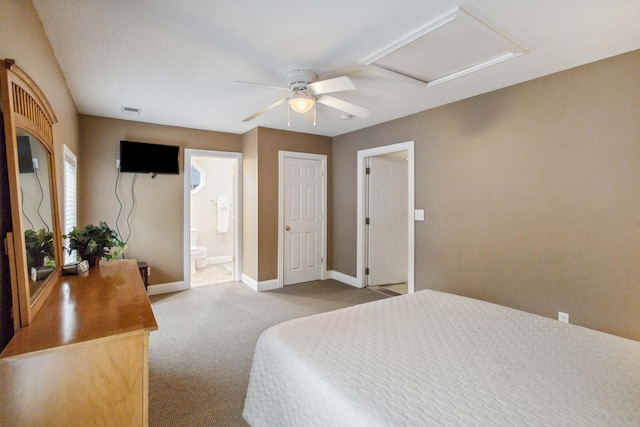 carpeted bedroom featuring ensuite bathroom and ceiling fan