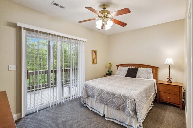 bedroom with dark colored carpet, ceiling fan, and access to exterior