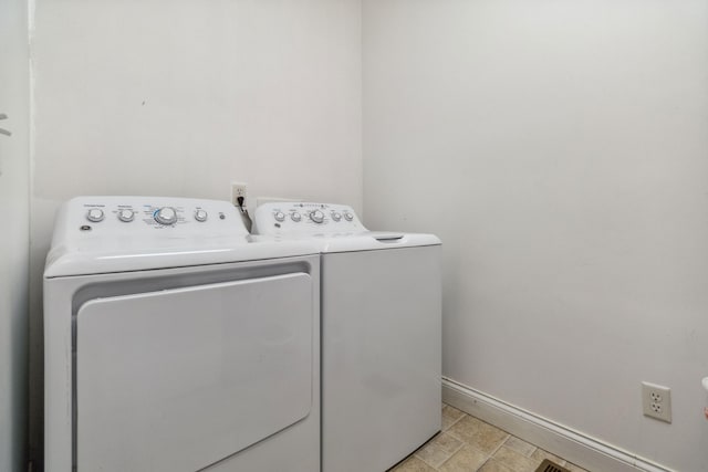 laundry area with washing machine and dryer