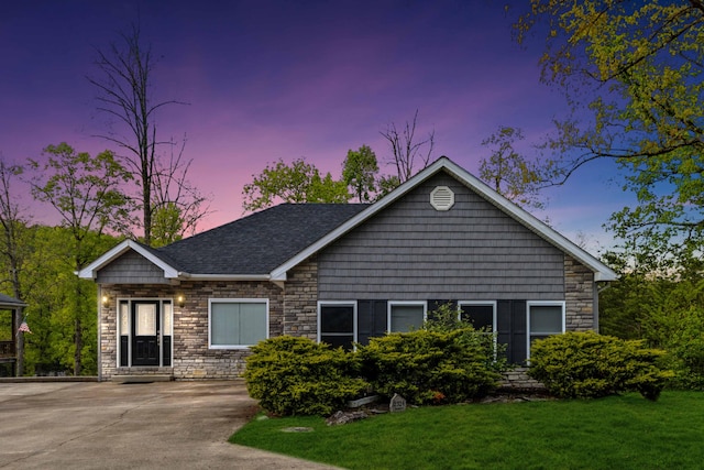 view of front of house with a yard