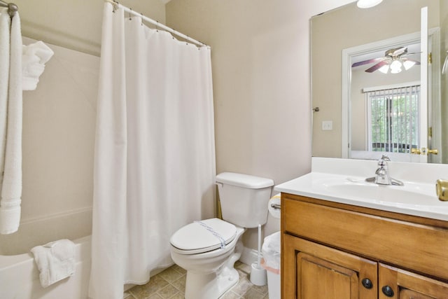 full bathroom featuring vanity, ceiling fan, toilet, and shower / bath combination with curtain