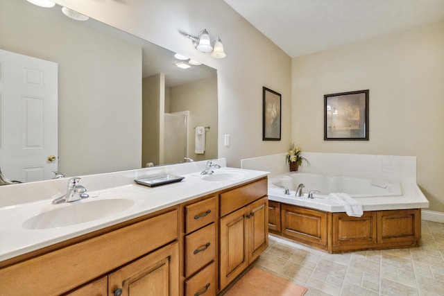 bathroom featuring shower with separate bathtub and vanity