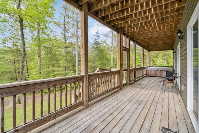 deck featuring a hot tub