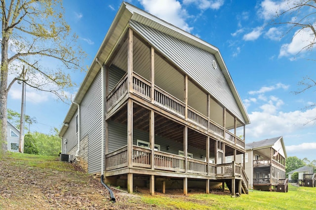 rear view of property featuring central AC