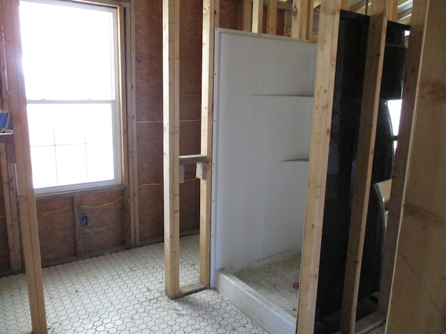 bathroom with tile flooring