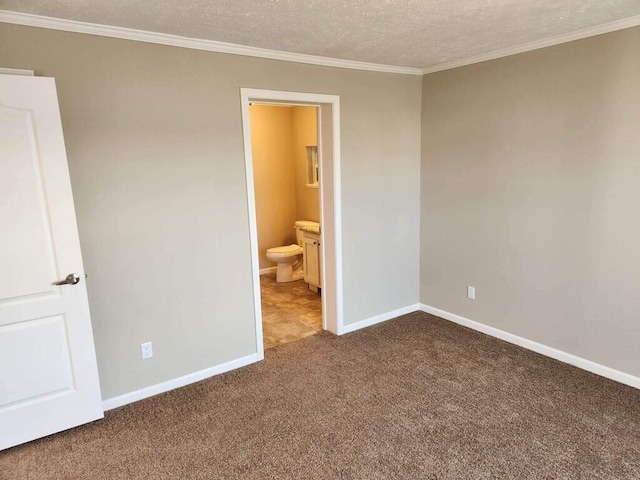 tiled spare room featuring a textured ceiling and crown molding