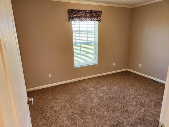 unfurnished room featuring dark carpet and ornamental molding