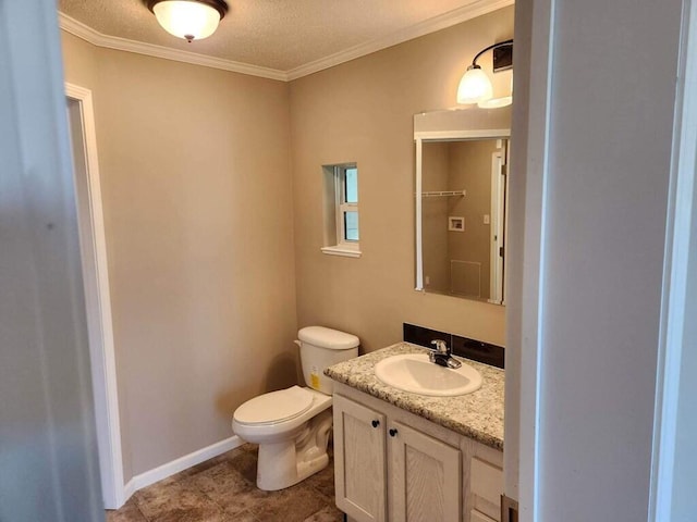 bathroom featuring tile flooring, toilet, vanity, a textured ceiling, and ornamental molding