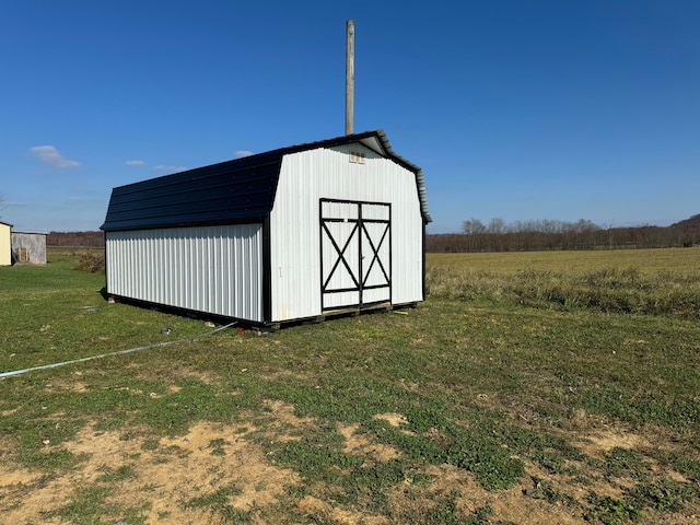 view of shed / structure with a lawn