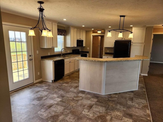 kitchen with hanging light fixtures, black appliances, and dark tile flooring