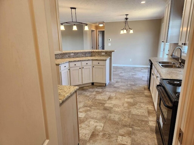 kitchen with decorative light fixtures, light tile floors, black appliances, light stone countertops, and sink