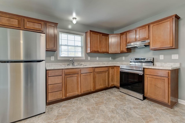 kitchen with light stone countertops, light tile flooring, sink, stainless steel refrigerator, and electric range oven