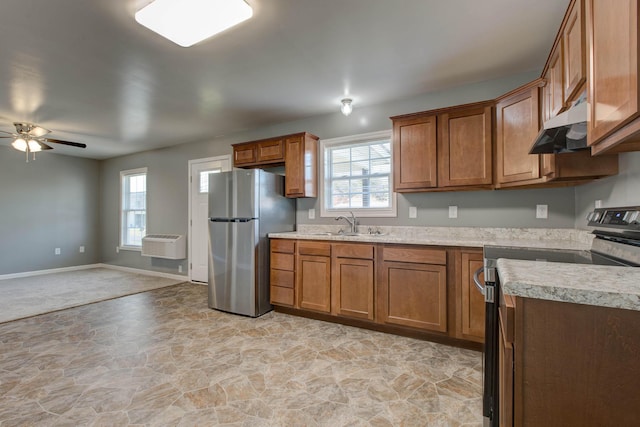 kitchen featuring light tile floors, ceiling fan, appliances with stainless steel finishes, and sink