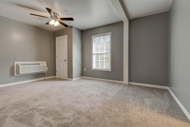 carpeted empty room with a wall mounted AC and ceiling fan