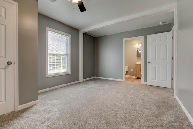 carpeted empty room with ceiling fan