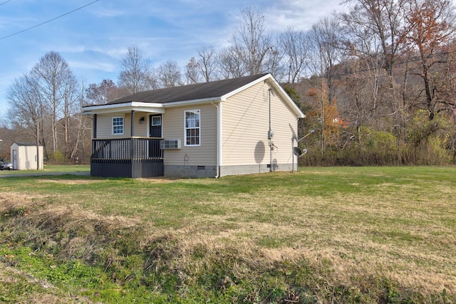 exterior space with a yard and a storage shed