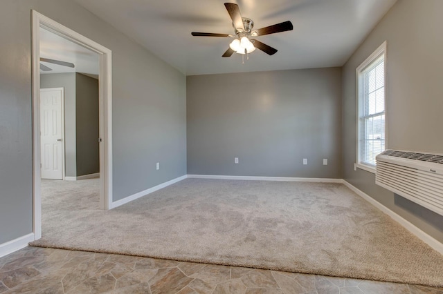 carpeted spare room featuring ceiling fan