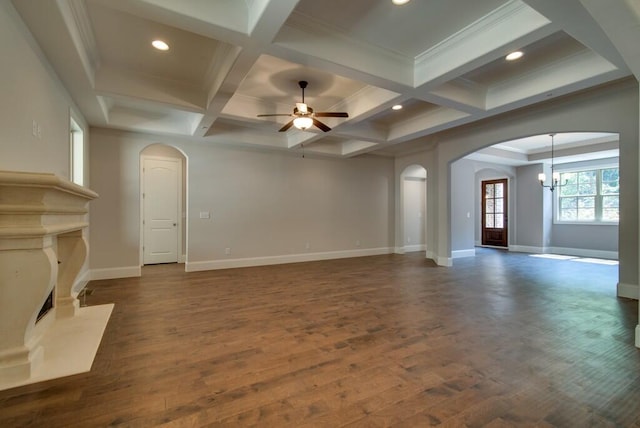 unfurnished living room featuring coffered ceiling, beam ceiling, dark hardwood / wood-style floors, and ceiling fan with notable chandelier