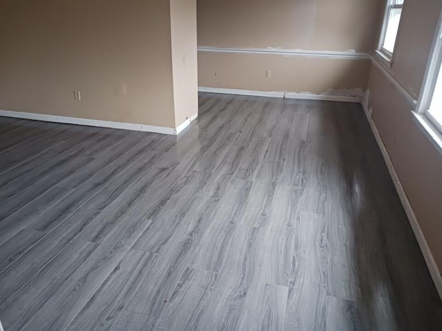 spare room with hardwood / wood-style floors