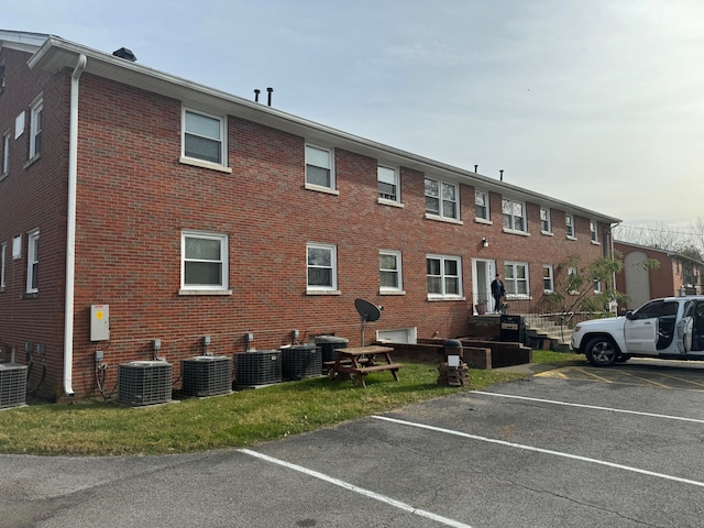 view of building exterior with central AC unit