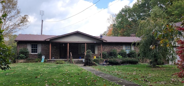 single story home featuring a porch and a front lawn