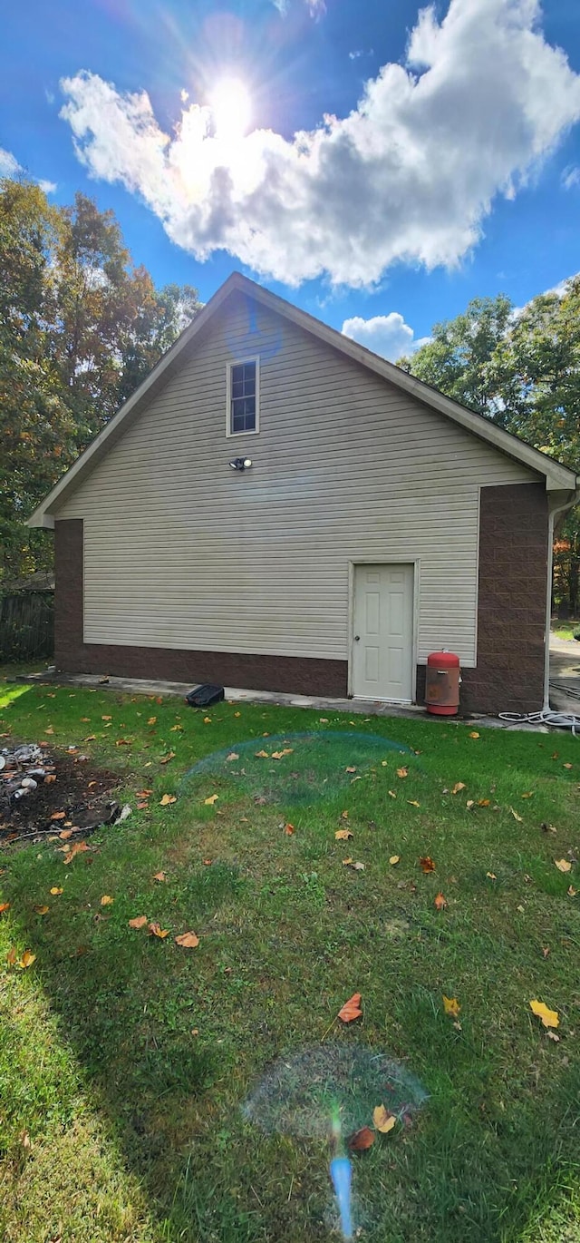 view of home's exterior featuring a yard