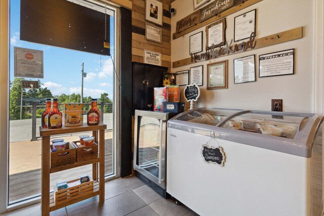 kitchen featuring beverage cooler and tile patterned flooring