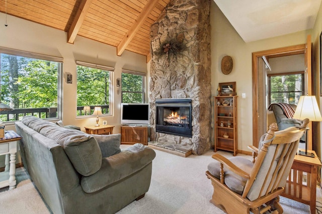 living area featuring carpet, high vaulted ceiling, a stone fireplace, wooden ceiling, and beamed ceiling