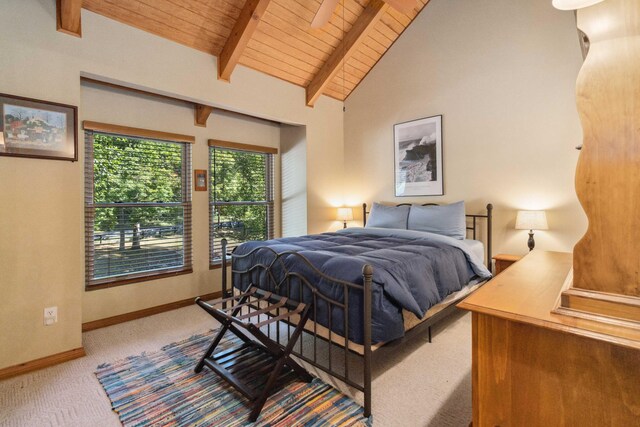 bedroom with wood ceiling, high vaulted ceiling, light colored carpet, and beam ceiling