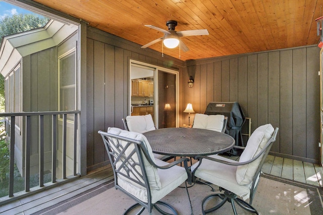 exterior space featuring ceiling fan and wooden ceiling