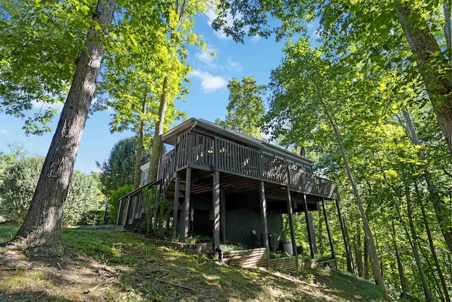 back of property with stairway and a wooden deck