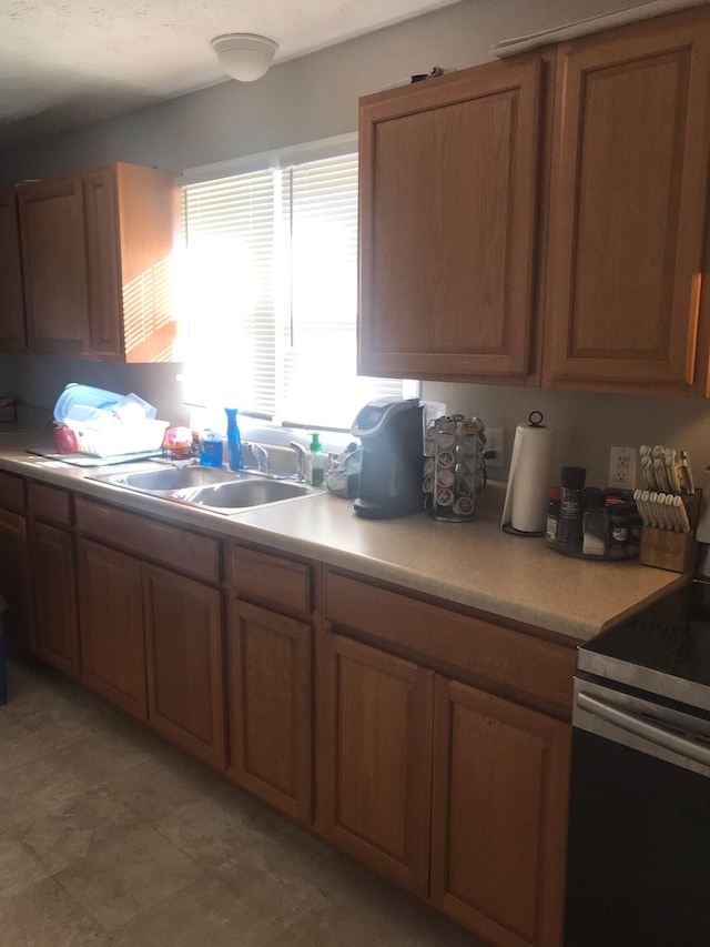 kitchen with electric range and sink