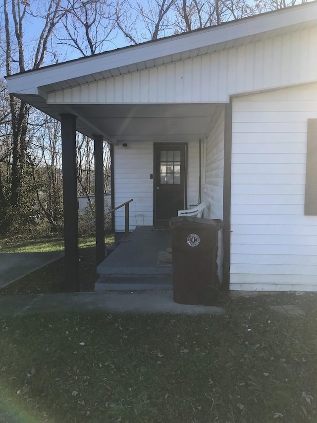 doorway to property with a carport