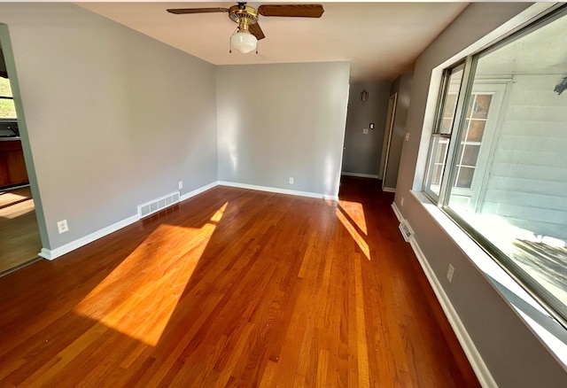 spare room with ceiling fan and wood-type flooring